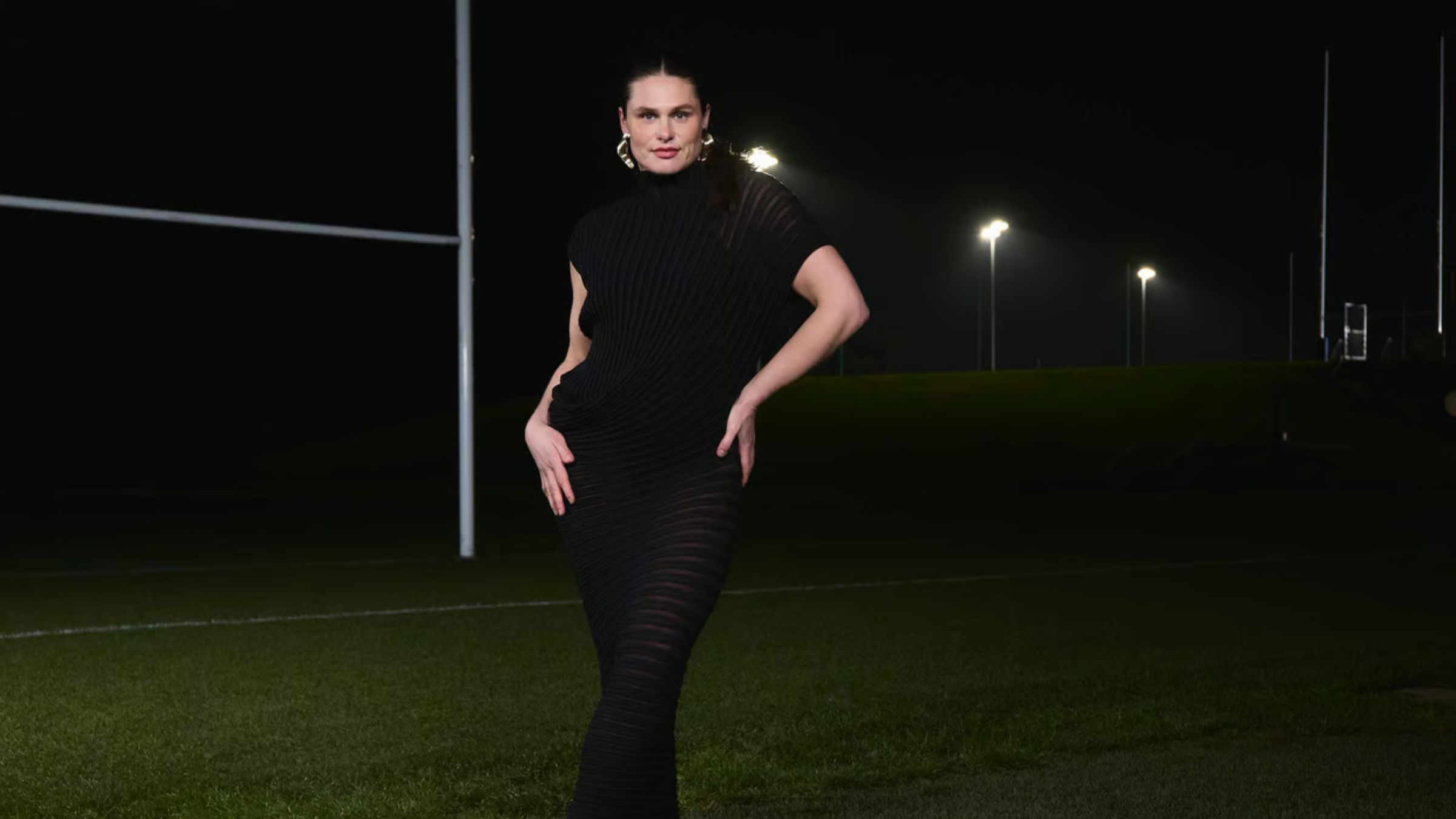 ilona maher wears sculptural gold earrings.