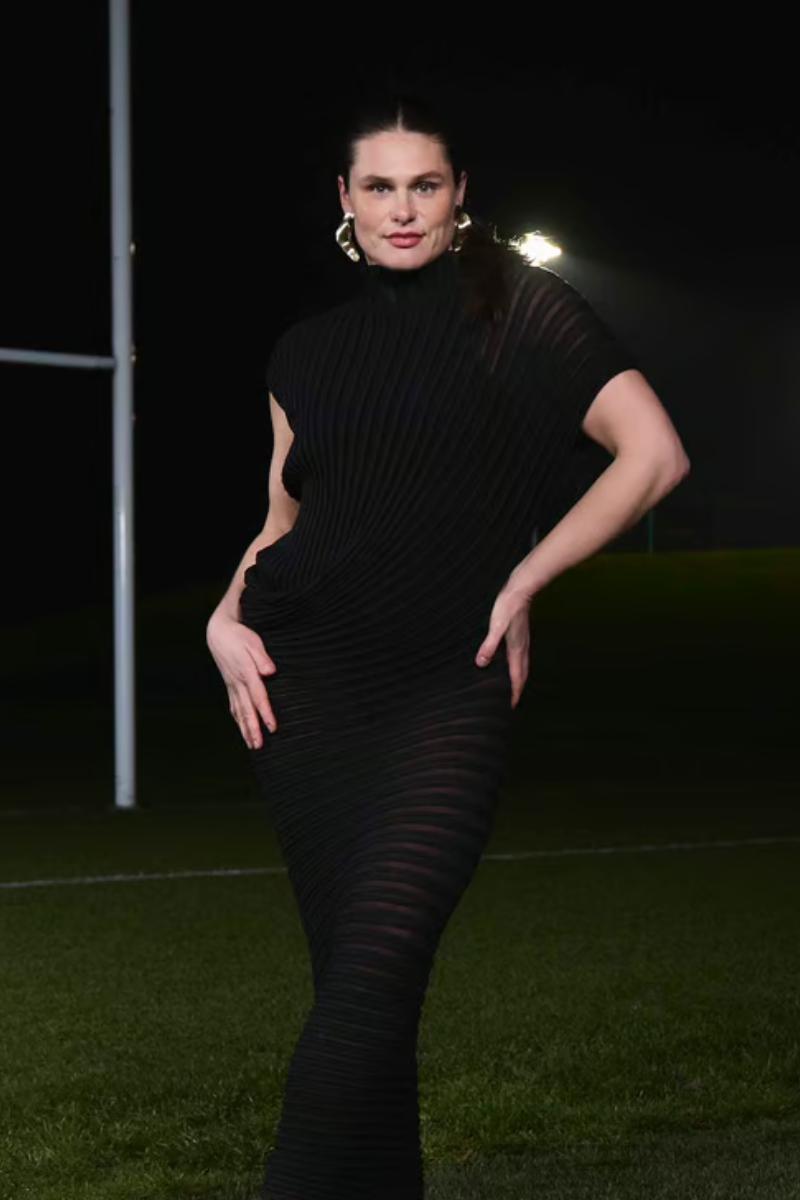 ilona maher wears sculptural gold earrings.